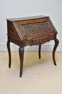 Lot 1037 - A 19th century Dutch carved oak bureau, with...