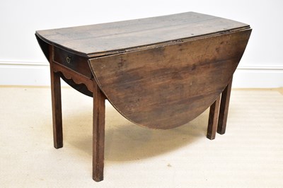 Lot 1298 - A 19th century oak gateleg table on square...
