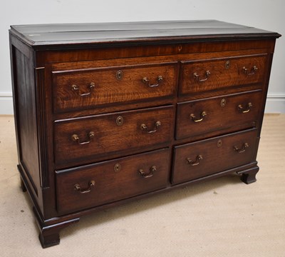 Lot 1038 - An 18th century oak mule chest with hinged lid,...