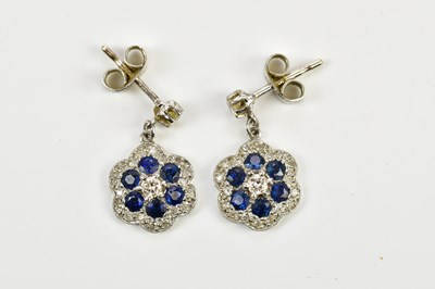 Lot 320 - A pair of white metal diamond and sapphire...