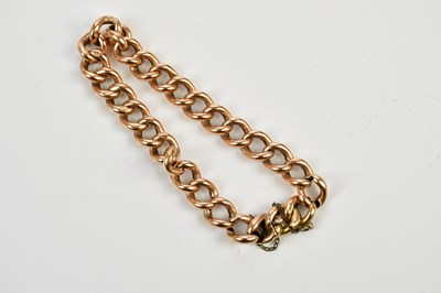 Lot 422 - A rose coloured metal curb link bracelet...