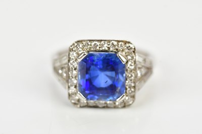 Lot 26 - A white metal diamond and sapphire dress ring...