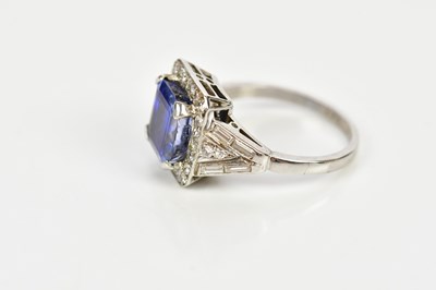 Lot 26 - A white metal diamond and sapphire dress ring...