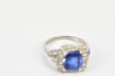 Lot 26 - A white metal diamond and sapphire dress ring...