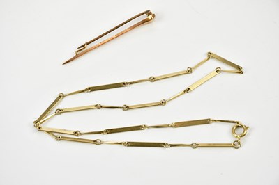 Lot 379 - A Victorian yellow metal bar brooch and a...