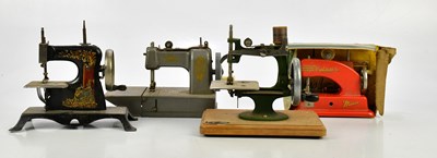 Lot 1672 - Four vintage child’s sewing machines,...