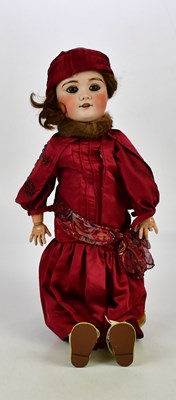 Lot 31 - LIMOGES, FRANCE; a bisque headed doll with...
