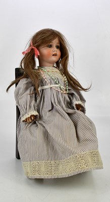 Lot 32 - MAX HANDWERCK; a German bisque headed doll...