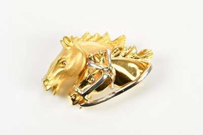 Lot 348 - An 18ct yellow gold brooch formed as two horse...