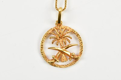 Lot 267 - An 18ct yellow gold palm tree and crossed...