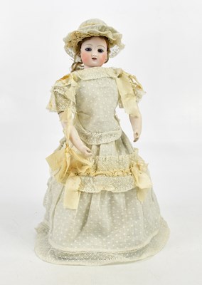 Lot 21 - An unusual bisque automaton rolling/walking...