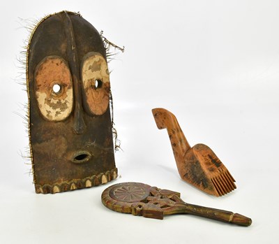 Lot 2594 - A carved wood African tribal mask, possibly...