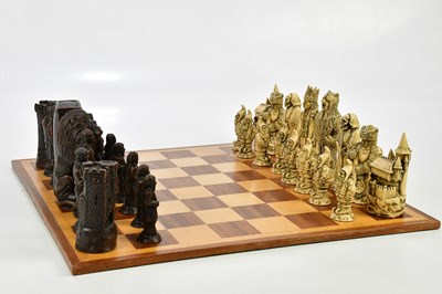 Lot 1601 - A modern resin chess set with board.