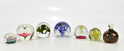 Lot 2566 - Seven glass paperweights including a...