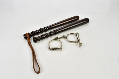 Lot 1638 - Two vintage police truncheons and a set of...