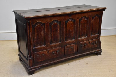 Lot 1386 - An 18th century oak coffer with hinged lid...