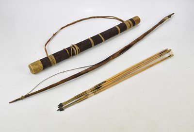 Lot 2607 - An African style bow and arrows within carved...
