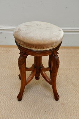 Lot 1291 - An  Edwardian walnut adjusting piano stool,...