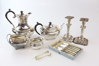 Lot 1755 - A silver plated four piece tea set together...