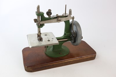 Lot 1686 - GRAIN; a miniature table sewing machine.