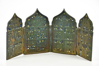 Lot 1593 - A probably Russian brass quadriptych,...