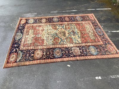 Lot 1472 - A good quality Zeigler rug on a blue/red...