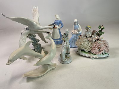 Lot 321 - A group of decorative porcelain figures...