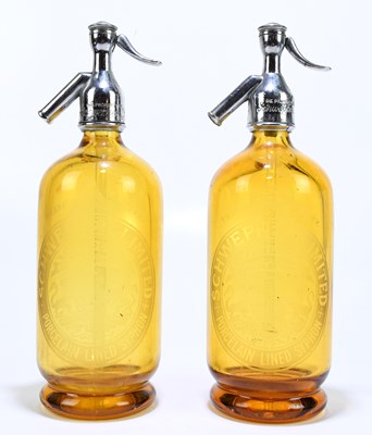 Lot 45 - THWAITES; a pair of amber coloured glass soda...