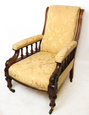 Lot 1560 - A late Victorian carved walnut framed armchair...