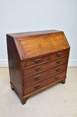 Lot 1378 - A Georgian oak bureau, the fall front with...