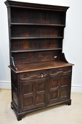 Lot 1366 - A 19th century oak dresser with boarded plate...