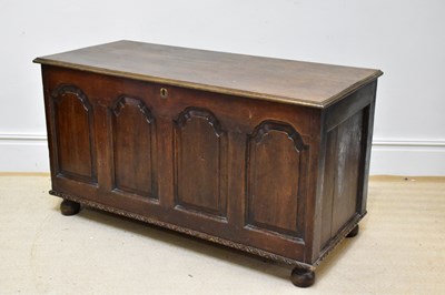 Lot 1156 - A 19th century oak coffer with hinged lid...