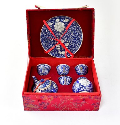 Lot 203 - A small modern Chinese seven-piece blue ground...