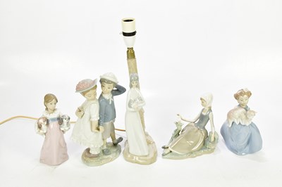 Lot 2825 - LLADRO; a collection of four figures...