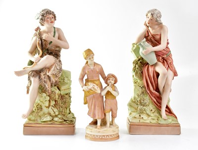 Lot 284 - ROYAL DUX; a pair of figures, one holding a...