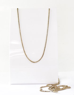 Lot 1223 - A yellow metal snake link muff chain with hoop...