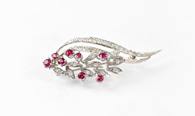 Lot 1167 - An 18ct white gold floral spray brooch set...