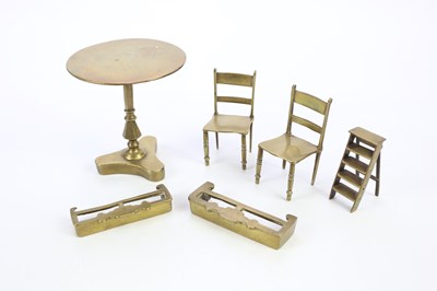 Lot 1741 - A small collection of miniature brass...