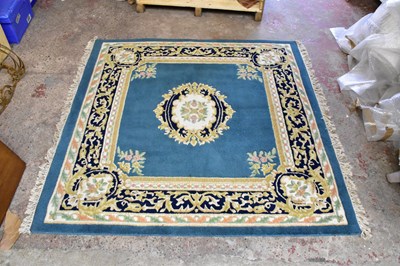 Lot 1493 - A Chinese super wash rug with central floral...