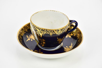 Lot 2365 - BERLIN; a hand painted teacup and saucer, the...