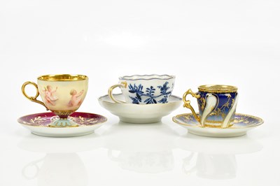 Lot 2369 - VIENNA; a hand painted teacup and saucer,...