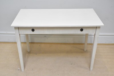 Lot 1097 - A modern cream painted side table with single...