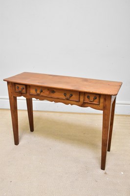 Lot 1301 - A Continental pine console table with three...