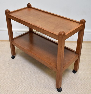 Lot 2007 - WORKSHOP OF ROBERT THOMPSON; an oak two tier...