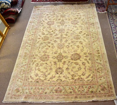 Lot 1458 - A large Eastern style Ferahagn rug with floral...
