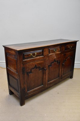 Lot 1367 - An 18th century oak dresser base, with three...