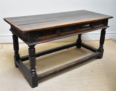 Lot 1361 - An 18th century oak refectory table with three...