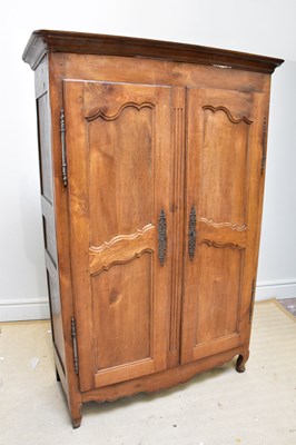 Lot 1084 - A reproduction armoire with moulded cornice...