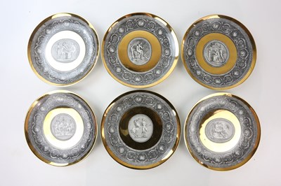 Lot 2231 - PIERO FORNASETTI; a set of six gilt and...