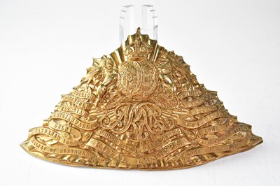 Lot 453 - A brass Royal Lancers helmet plate.